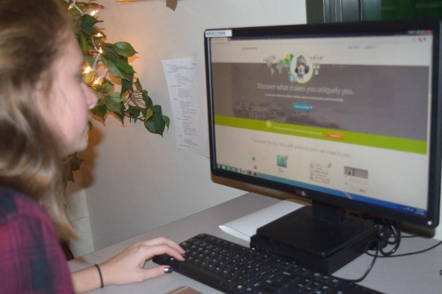 Sophomore Carly Herbert looks into the new Ancestry program during lunch.
Students can find out family history before or after school on any school server.