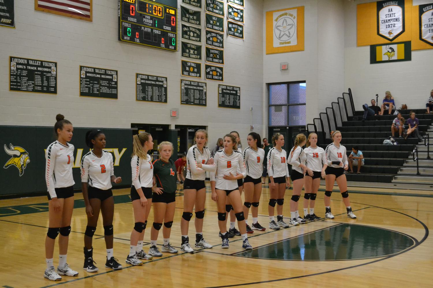 Girls Volleyball lines up before a match. 