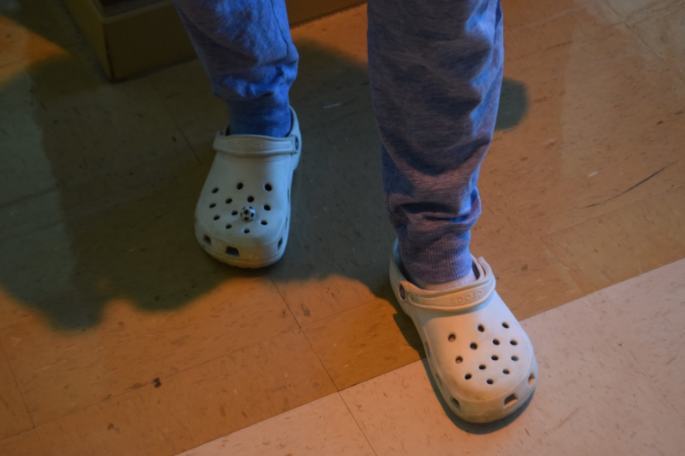 Wearing Crocs, sophomore Sarah Scardina walks through the cafeteria, she wears a soccer ball Jibbit on her right shoe.
