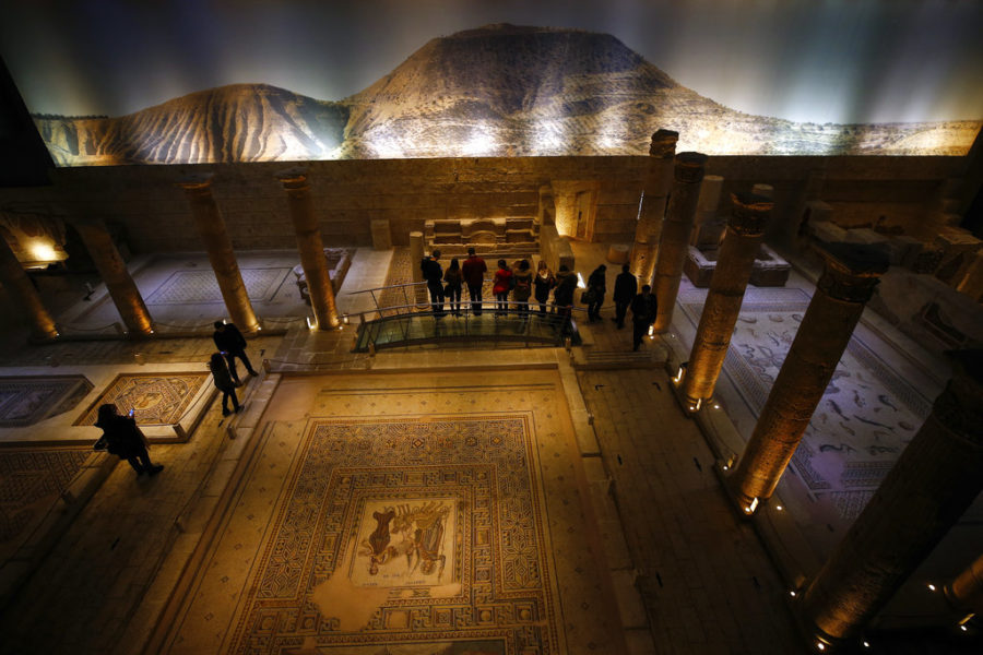 People visit the main exhibition hall of Zeugma Mosaic Museum, in Gaziantep, Turkey, Saturday, Dec. 8, 2018. A display of Roman-era mosaics that were part of a U.S. universitys art collection and were returned to Turkey, more than half a century after looters smuggled them out, opened at the museum. Ohios Bowling Green State University bought the 12 mosaics from a New York gallery in 1965. Turkish and Bowling Green officials agreed to their return in May 2018. (AP Photo/Emrah Gurel)