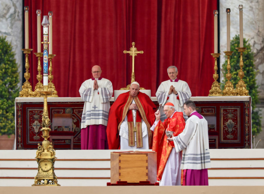 Cardinal Giovanni Battista Re blesses the coffin of former Pope Benedict during his funeral as Pope Francis presides over the ceremonies, in St. Peters Square at the Vatican, January 5, 2023. REUTERS/Kai Pfaffenbach