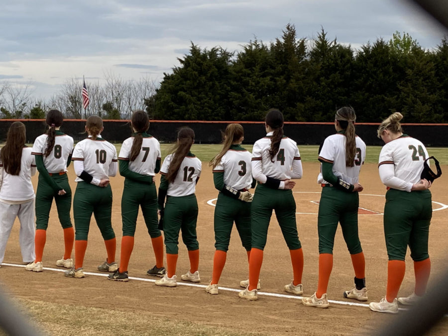 Varsity+softball+standing+for+the+National+Anthem+before+their+9-4+win+at+Brentsville.