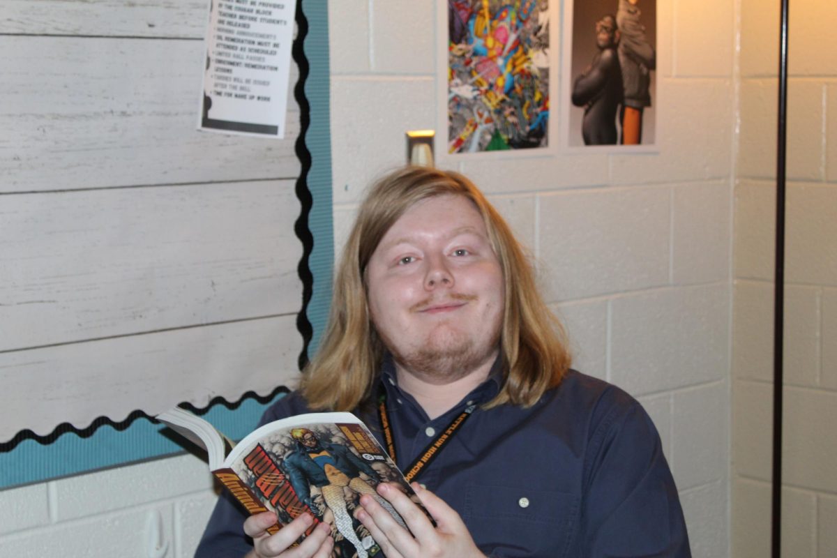 Mr. Watson enjoying a comic book break during his planning block. 